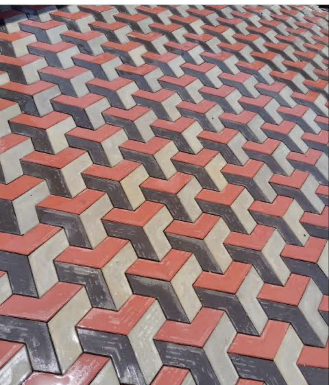Laid 3D model V shape design pavers in red, grey and charcoal