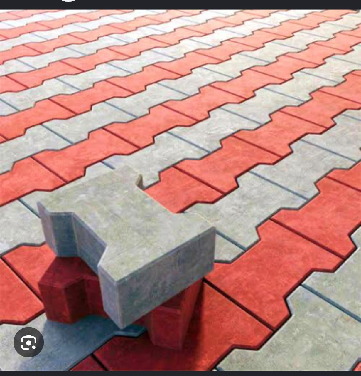 Red and grey interlocking paver blocks with a thick permanent colour top layer