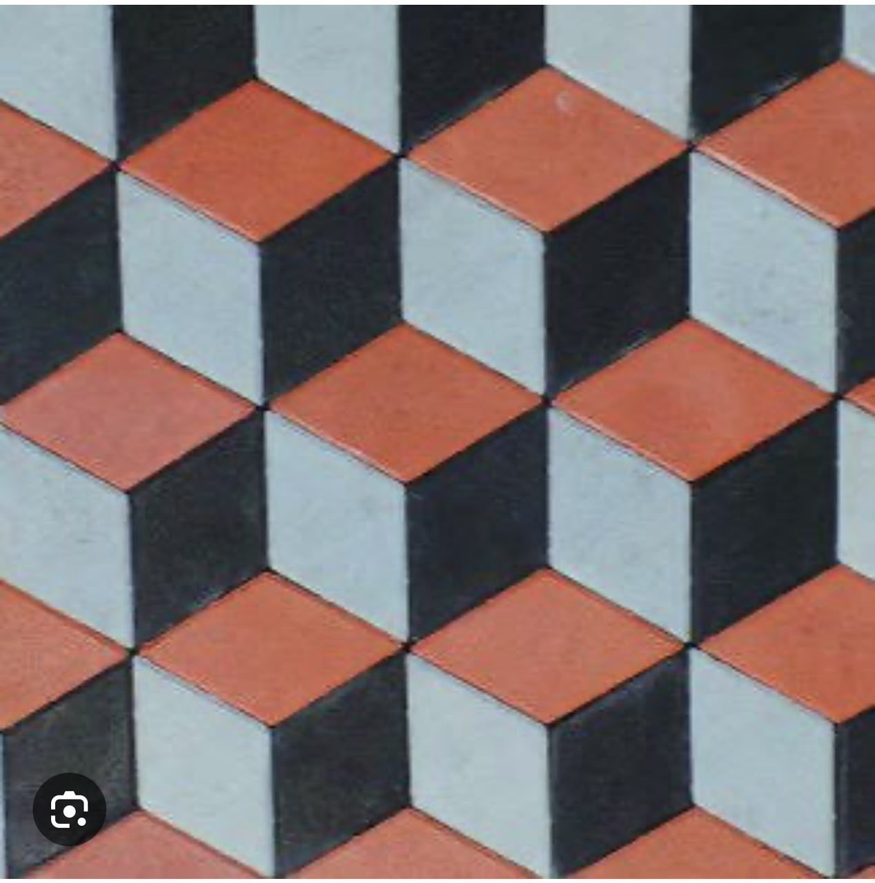 Laid 3D cubic pattern pavers in terracotta, white and black creating a depth illusion