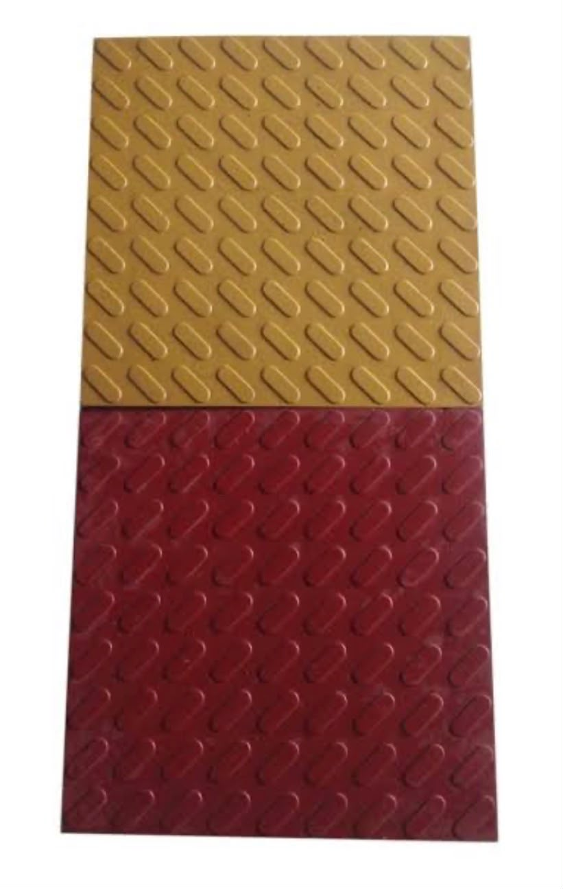 Yellow and red textured paver block parking tiles